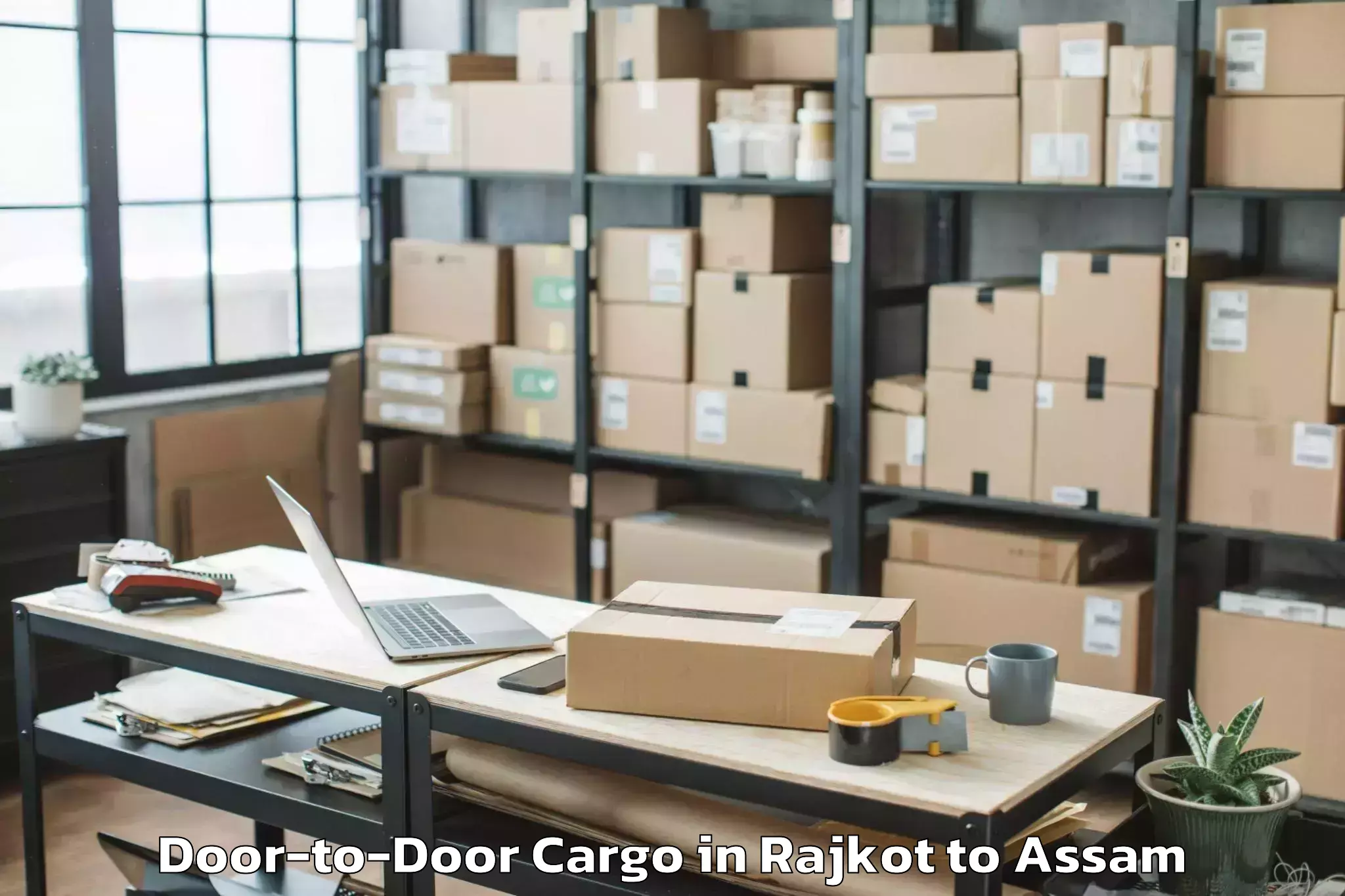 Quality Rajkot to Lumding Railway Colony Door To Door Cargo